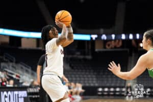Omaha Mavericks Ja Harvey looks to shoot during a college basketball game against North Dakota on January 2nd, 2025 in Omaha Nebraska. Photo by Brandon Tiedemann.