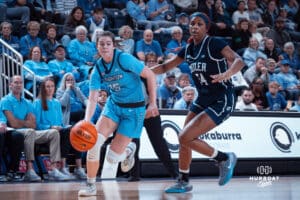 Creighton Bluejays Lauren Jensen makes her way past a defender against the Butler Bulldogs during a college basketball game on Wednesday, January 1, 2025 in Omaha, Nebraska. Photo by Logan Hock.