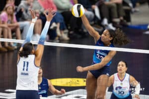 Omaha Supernovas Kaitlyn Hord (23) spikes the ball against Orlando Valkyrie Kazmiere Bronw (11) during professional volleyball event Thursday, February 27, 2025 in Lincoln, Nebraska. Photo by John S. Peterson.
