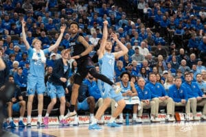 Creighton Bluejays Isaac Traudt makes a three as a defender looks on during a college basketball game against Depaul on February 26th, 2025 in Omaha Nebraska. Photo by Brandon Tiedemann.