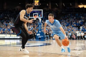 Creighton Bluejays Steven Ashworth looks to get past a defender during a college basketball game against Depaul on February 26th, 2025 in Omaha Nebraska. Photo by Brandon Tiedemann.