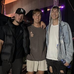 Simon Latkoczy poses with rap duo Neries after a show