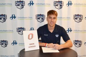 Simon Latkoczy signs his National Letter of intent to play for Omaha on Nov. 17, 2021.