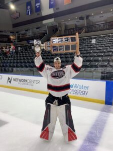 Simon Latkoczy poses with 2021 USHL championship trophy