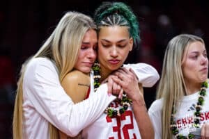 Nebraska Cornhusker forward Kendall Coley (32) recieves a hug from Natalie Potts during the Senior Day celebration after a college women’s basketball game against the Washington Huskies Sunday, February 23, 2025 in Lincoln, Nebraska. Photo by John S. Peterson.