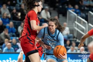 Creighton Bluejays Lauren Jensen looks to get past a defender during a college basketball game against St. Johns on February 19th, 2025 in Omaha Nebraska. Photo by Brandon Tiedemann.