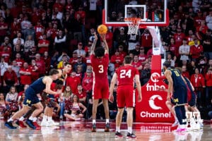 Nebraska Cornhusker guard Brice Williams (3) makes a three throw against the Michigan Wolverines late in the second half during a college men’s basketball game Monday, February 24, 2025 in Lincoln, Nebraska. Photo by John S. Peterson.