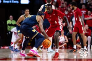 Nebraska Cornhusker forward Juwan Gary (4) defends against Michigan Wolverine guard Roddy Gayle Jr. (11) in the first half during a college men’s basketball game Monday, February 24, 2025 in Lincoln, Nebraska. Photo by John S. Peterson.