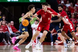 Nebraska Cornhusker forward Berke Buyuktuncel (9) guards Michigan Wolverine guard Justin Pippen (10) in the first half during a college men’s basketball game Monday, February 24, 2025 in Lincoln, Nebraska. Photo by John S. Peterson.
