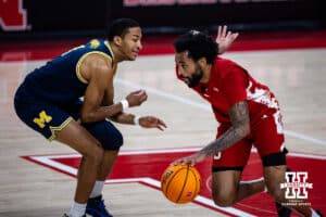 Nebraska Cornhusker guard Brice Williams (3) dribbles the ball against Michigan Wolverine guard Nimari Burnett (4) in the first half during a college men’s basketball game Monday, February 24, 2025 in Lincoln, Nebraska. Photo by John S. Peterson.