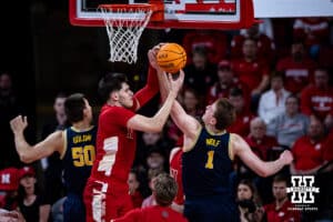 Nebraska Cornhusker forward Berke Buyuktuncel (9) and Michigan Wolverine center Danny Wolf (1) go for the rebound in the first half during a college men’s basketball game Monday, February 24, 2025 in Lincoln, Nebraska. Photo by John S. Peterson.