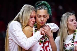 Nebraska Cornhusker forward Kendall Coley (32) recieves a hug from Natalie Potts during the Senior Day celebration after a college women’s basketball game against the Washington Huskies Sunday, February 23, 2025 in Lincoln, Nebraska. Photo by John S. Peterson.