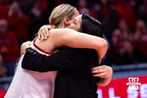 Nebraska Cornhusker head coach Amy Williams gives a hug to center Alexis Markowski (40) during Senior Day celebration after a college women’s basketball game against the Washington Huskies Sunday, February 23, 2025 in Lincoln, Nebraska. Photo by John S. Peterson.