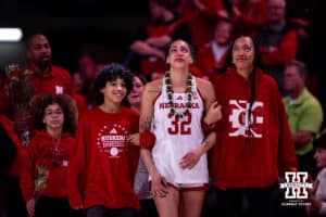 Nebraska Cornhusker forward Kendall Coley (32) esorted to center court for Senior Day celebration after a college women’s basketball game against the Washington Huskies Sunday, February 23, 2025 in Lincoln, Nebraska. Photo by John S. Peterson.