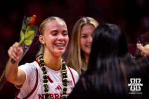 Nebraska Cornhusker guard Alberte Rimdal (5) gives head coach Amy Williams a hug during the Senior Day celebration after a college women’s basketball game against the Washington Huskies Sunday, February 23, 2025 in Lincoln, Nebraska. Photo by John S. Peterson.