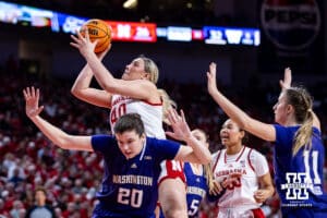 Nebraska Cornhusker center Alexis Markowski (40) makes a basket against Washington Huskies forward Brenna McDonald (20) in the second half during a college women’s basketball game Sunday, February 23, 2025 in Lincoln, Nebraska. Photo by John S. Peterson.