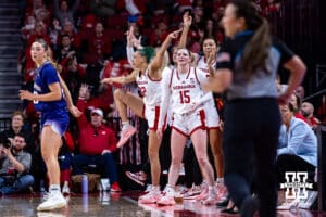 Nebraska Cornhuskers bench mob celebrates a three-point shot against the Washington Huskies during a college women’s basketball game Sunday, February 23, 2025 in Lincoln, Nebraska. Photo by John S. Peterson.