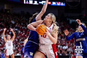 Nebraska Cornhusker center Alexis Markowski (40) makes a basket against Washington Huskies forward Brenna McDonald (20) second quarter during a college women’s basketball game Sunday, February 23, 2025 in Lincoln, Nebraska. Photo by John S. Peterson.