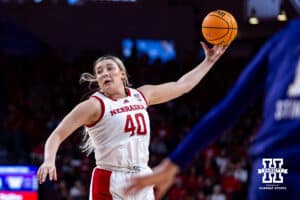 Nebraska Cornhusker center Alexis Markowski (40) reaches for a rebound against the Washington Huskiess in the second quarter during a college women’s basketball game Sunday, February 23, 2025 in Lincoln, Nebraska. Photo by John S. Peterson.