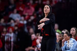 Nebraska Cornhusker head coach Amy Williams gives a signal against the Washington Huskies in the first half during a college women’s basketball game Sunday, February 23, 2025 in Lincoln, Nebraska. Photo by John S. Peterson.