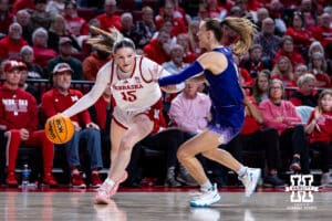 Nebraska Cornhusker guard Kendall Moriarty (15) drives to the basket against Washington Huskies guard Teagan Brown (5)in the first half during a college women’s basketball game Sunday, February 23, 2025 in Lincoln, Nebraska. Photo by John S. Peterson.
