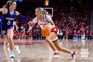 Nebraska Cornhusker guard Alberte Rimdal (5) drives to the lane against Washington Huskies guard Teagan Brown (5) in the first quarter during a college women’s basketball game Sunday, February 23, 2025 in Lincoln, Nebraska. Photo by John S. Peterson.
