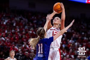 Nebraska Cornhusker forward Jessica Petrie (12) makes a jumpshot against Washington Huskies guard Chloe Briggs (11) in the first quarter during a college women’s basketball game Sunday, February 23, 2025 in Lincoln, Nebraska. Photo by John S. Peterson.