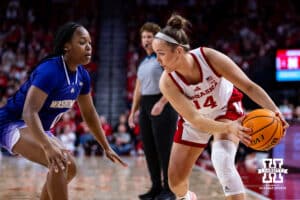 Nebraska Cornhusker guard Callin Hake (14) controls the ball against Washington Huskies guard Sayvia Sellers (0) in the first quarter during a college women’s basketball game Sunday, February 23, 2025 in Lincoln, Nebraska. Photo by John S. Peterson.