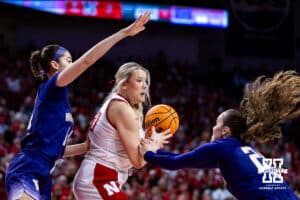Nebraska Cornhusker center Alexis Markowski (40) battles against Washington Huskies guard Elle Ladine (24) and forward Dalayah Daniels (14) in the first quarter during a college women’s basketball game Sunday, February 23, 2025 in Lincoln, Nebraska. Photo by John S. Peterson.