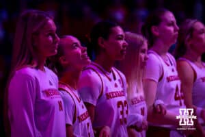 Nebraska Cornhusker guard Alberte Rimdal (5) watches the overhead screen as the Danish national anthem of her homeland is played for her during a college women’s basketball game against the Washington Huskies Sunday, February 23, 2025 in Lincoln, Nebraska. Photo by John S. Peterson.