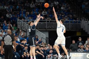 Creighton Bluejays Ryan Kalkbrenner contests a shot during a college basketball game against Georgetown on February 23rd, 2025 in Omaha Nebraska. Photo by Brandon Tiedemann.