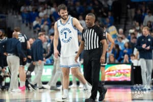 Creighton Bluejays Fedor Žugić laughs with a ref during a college basketball game against Georgetown on February 23rd, 2025 in Omaha Nebraska. Photo by Brandon Tiedemann.
