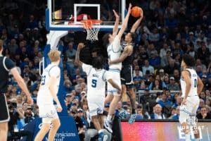 Creighton Bluejays Ryan Kalkbrenner blocks a dunk attempt during a college basketball game against Georgetown on February 23rd, 2025 in Omaha Nebraska. Photo by Brandon Tiedemann.