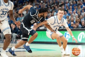 Creighton Bluejays Steven Ashworth looks to get past a defender during a college basketball game against Georgetown on February 23rd, 2025 in Omaha Nebraska. Photo by Brandon Tiedemann.