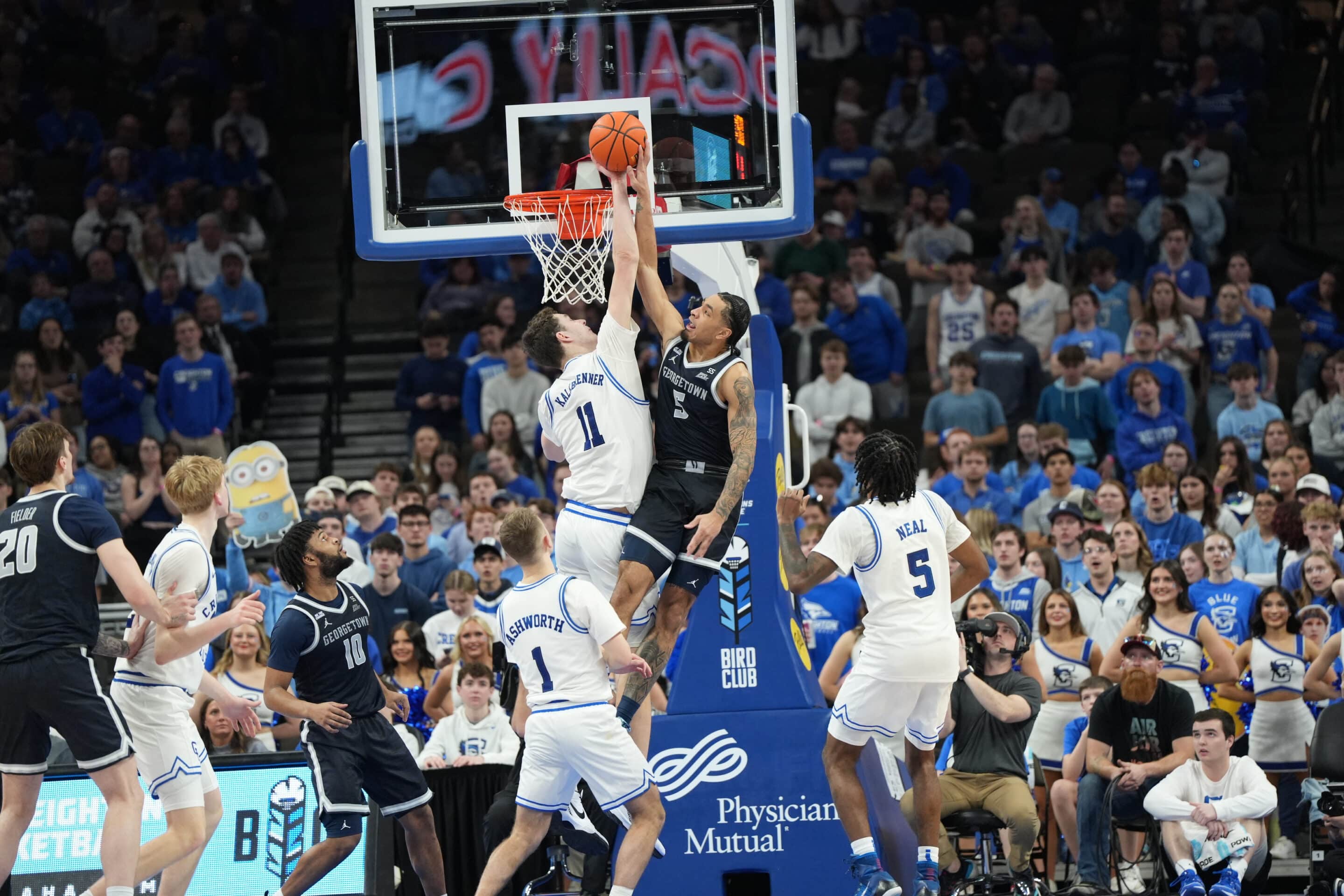 Creighton center Ryan Kalkbrenner denies a Micah Peavy dunk attempt in the Bluejays' 80-69 win over Georgetown. Photo by Brandon Tiedemann.