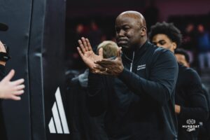 Omaha Maverick head coach Chris Crutchfield celebrates with fans during a basketball game at Baxter Arena on February 22nd, 2025 in Omaha Nebraska. Photo by Collin Stilen.