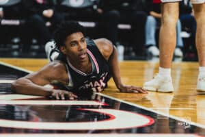 Omaha Maverick Marquel Sutton falls to the floor after fouled on a layup attempt during a basketball game at Baxter Arena on February 22nd, 2025 in Omaha Nebraska. Photo by Collin Stilen.