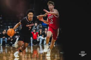 Omaha Maverick Lance Waddles takes on his opponent and drives to the bucket during a basketball game at Baxter Arena on February 22nd, 2025 in Omaha Nebraska. Photo by Collin Stilen.