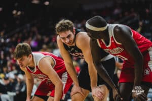 Omaha Maverick Joshua Streit talks with South Dakota player while waiting for a free throw during a basketball game at Baxter Arena on February 22nd, 2025 in Omaha Nebraska. Photo by Collin Stilen.