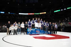 Burwell poses after winning the class D team championship during the 2025 Nebraska State Wrestling Championships on February 22nd, 2025 in Omaha Nebraska. Photo by Brandon Tiedemann.
