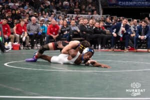 Kiernan Meink attempts to pin his oppentent during the 2025 Nebraska State Wrestling Championships on February 22nd, 2025 in Omaha Nebraska. Photo by Brandon Tiedemann.