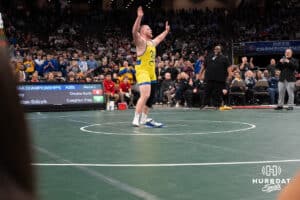 Tyson Terry puts his cleats on the mat during the 2025 Nebraska State Wrestling Championships on February 22nd, 2025 in Omaha Nebraska. Photo by Brandon Tiedemann.