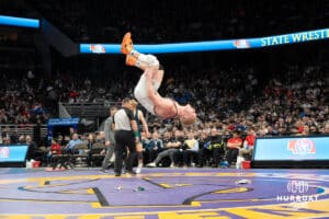 Merrick Johnson flips after winning the Class B157 match up during the 2025 Nebraska State Wrestling Championships on February 22nd, 2025 in Omaha Nebraska. Photo by Brandon Tiedemann.