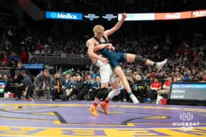 Merrick Johnson lifts oppentent during the 2025 Nebraska State Wrestling Championships on February 22nd, 2025 in Omaha Nebraska. Photo by Brandon Tiedemann.