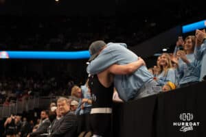 Kyler Lauridsen hugs a family member during the 2025 Nebraska State Wrestling Championships on February 22nd, 2025 in Omaha Nebraska. Photo by Brandon Tiedemann.