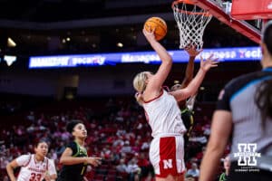Nebraska Cornhusker center Alexis Markowski (40) makes a layup against Oregon Duck forward Amina Muhammad (5) in the third quarter during a college women’s basketball game Wednesday, February 19, 2025 in Lincoln, Nebraska. Photo by John S. Peterson.