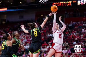 Nebraska Cornhusker guard Kendall Moriarty (15) makes a layup against Oregon Duck guard Elisa Mevius (8) in the third quarter during a college women’s basketball game Wednesday, February 19, 2025 in Lincoln, Nebraska. Photo by John S. Peterson.