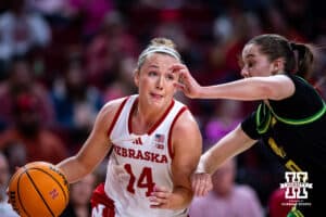 Nebraska Cornhusker guard Callin Hake (14) dribbles the ball against Oregon Duck guard Peyton Scott (10) in the second quarter during a college women’s basketball game Wednesday, February 19, 2025 in Lincoln, Nebraska. Photo by John S. Peterson.