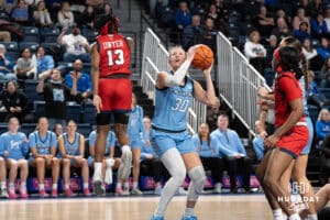 Creighton Bluejays Morgan Maly fakes out a defender during a college basketball game against St. Johns on February 19th, 2025 in Omaha Nebraska. Photo by Brandon Tiedemann.