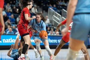 Creighton Bluejays Lauren Jensen looks to get past a defender during a college basketball game against St. Johns on February 19th, 2025 in Omaha Nebraska. Photo by Brandon Tiedemann.